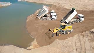 Wonderful! Land filling bulldozer pushing sand,dump truck 25 heavy equipment