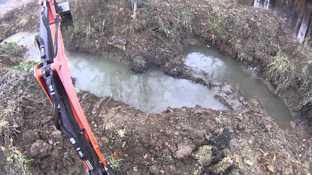 farm pond with a Kubota tractor and Wood's backhoe video - YouTube