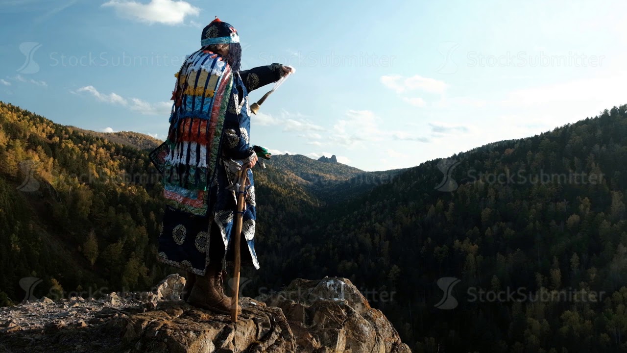 Magic shamanic ritual with a bell on the top of the mountain. - YouTube