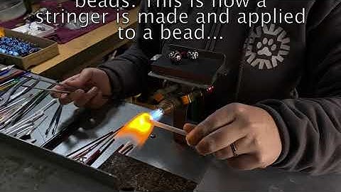Making a lampwork glass stringer and applying it to a bead | Larissa Spafford Designs | Bend, Oregon