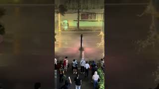 Two People Slip on a Sidewalk During a Windy Storm