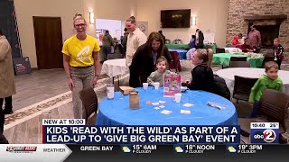 Family event at Dick Resch Center features children reading with wildlife animals