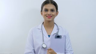 Beautiful young Indian female doctor smiling at the camera
