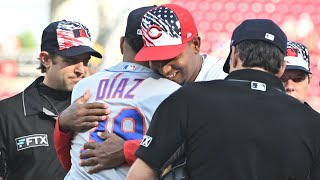 Brothers Alexis and Edwin Díaz exchange lineup cards