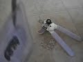 Opening plastic clamshell with can opener (wikiHow)