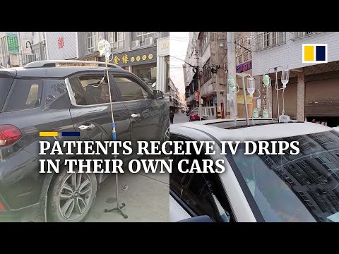 Patients in China hooked up to IV drips in their own cars as clinics are full