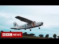 Plane built on Mumbai rooftop takes to the skies - BBC News