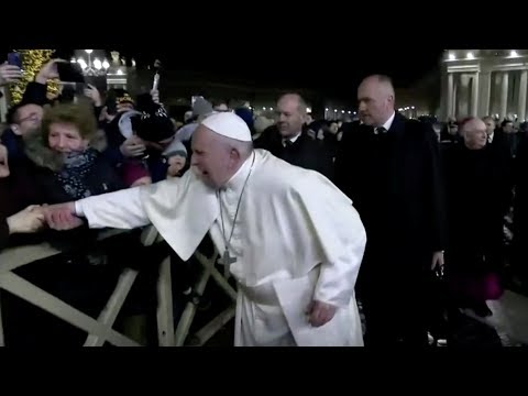 Pope slaps woman’s hand to free himself from her grip