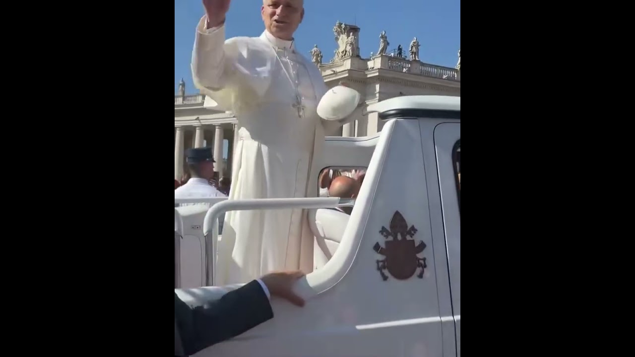 Pope Leo XIV receives a zuccetto from a pilgrim 