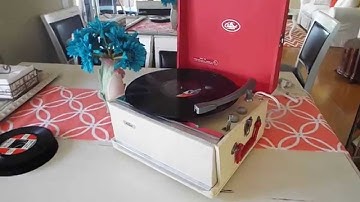 Capitol manual record player playing a 33.3 RPM LP record.