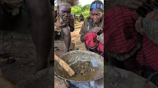 Eating a very hot food is culture in tribe See How he enjoys his favorite meal with his wife#hadzabe