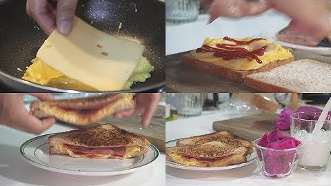 Fragrant breakfast: scrambled egg, cheese and ham sandwich.