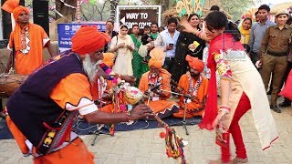 Women dancing to a Snake charmer's tune at Surajkund International Crafts Mela