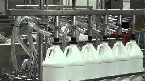 Pressure overflow liquid filler, filling water in Gallon Plastic Bottle, by Acasi Machinery