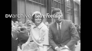 1960 - JFK and Jackie Kennedy drive through a ticker-tape parade