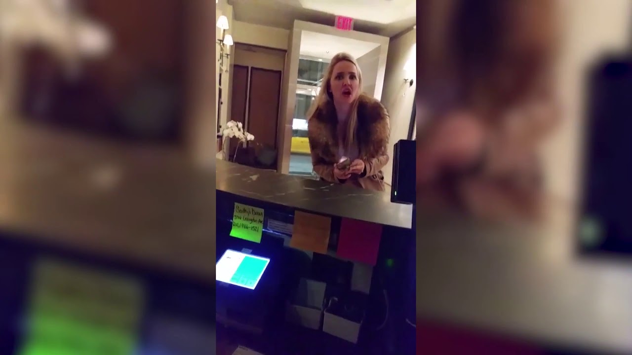 Woman yells racist slurs, spits on and assaults hotel receptionist ...