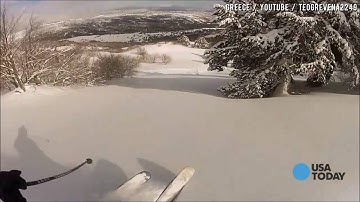 Helmet cam captures avalanche swallow skier