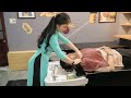 Vietnamese girl wears a relaxing long dress, acupressure, full nail clippers.