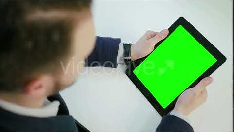 A Man Using an Tablet with a Green Screen | Stock Footage - Videohive