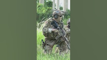Smart teamwork of soldiers walking forward and attacking enemy