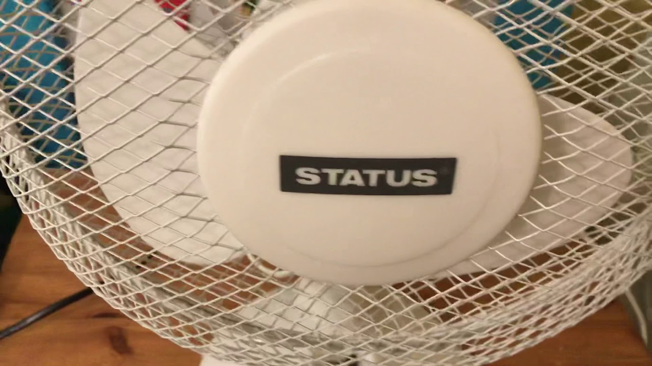 This is a status 9 inch white oscillating desk fan - YouTube