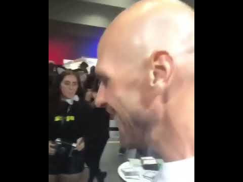 Johnny Sins signs on woman's chest