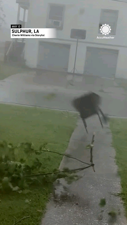 Chairs, Trees Fly By Louisiana Home During Storm