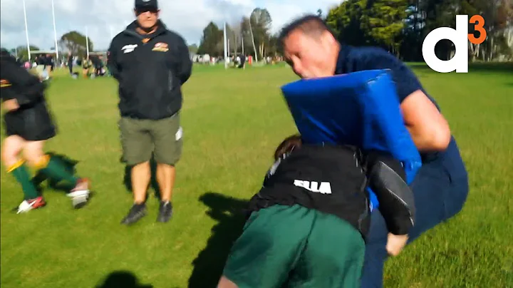 Watch as young girl tackles All Black Craig Dowd t...