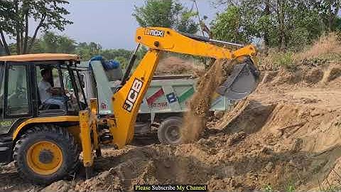 Jcb Backhoe machine loading soil In Heavy truck