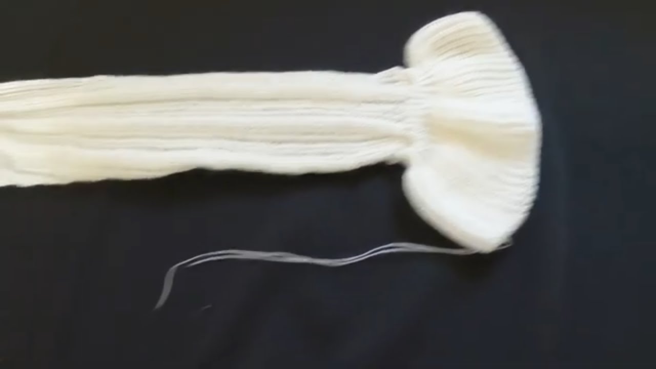 manga com babado feita em tricô à máquina