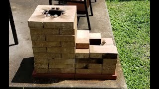 J shaped gravity fed brick rocket stove