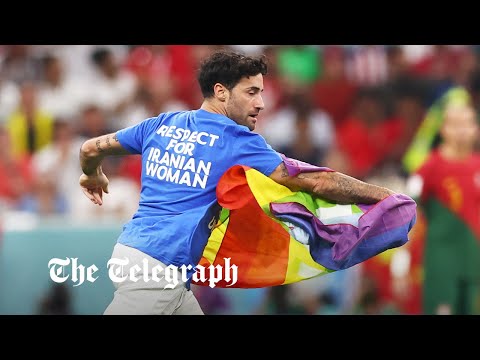 Rainbow-flag waving protester