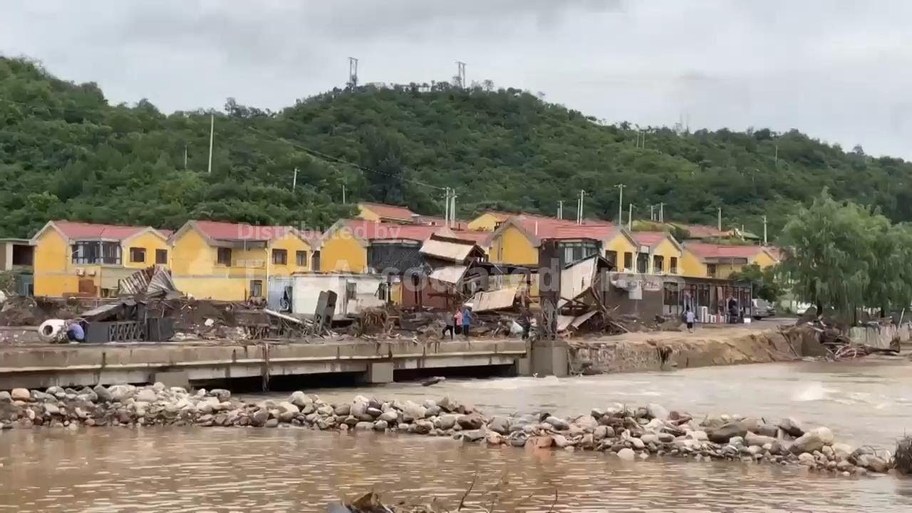Heavy rain causes flooding, evacuations and at least 38 deaths in Beijing region