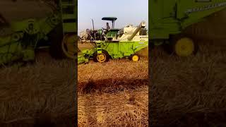 Balkar combine harvesting at brar farm in punjab