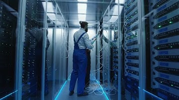 Two Technicians Working On Servers Stock Video