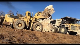 Caterpillar 992C Whell Loader Loading Rocks In 775D Dumper