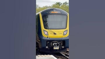 Class 701046 in Great British Railways branding departs Clandon for Waterloo