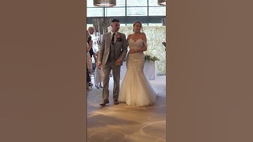 bride and groom walk up the aisle