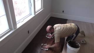 Richard applying Dark Walnut Stain over Red Oak Flooring