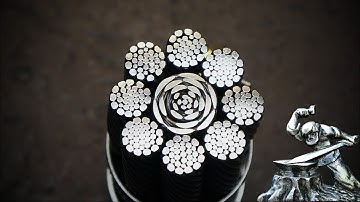 Damascus steel from rope. Steel flowers on the blade.