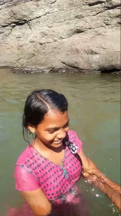 village girl bathing outdoor