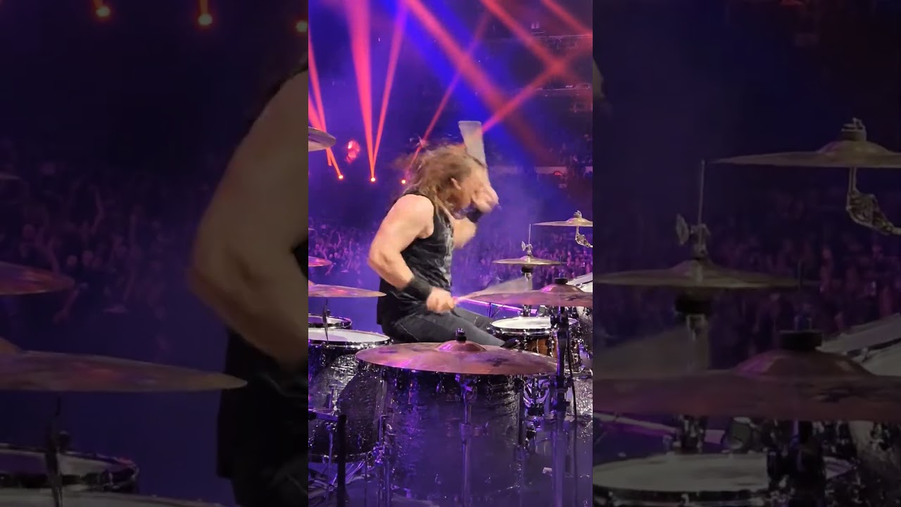 heavy metal drummer smashing drums in stadium what a performance