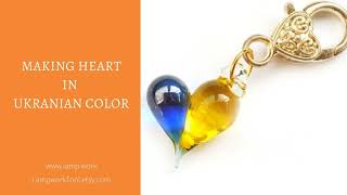 Lampwork bead - making a heart in Ukranian colors.