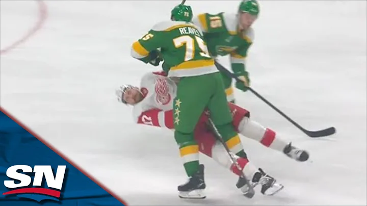 Wild's Ryan Reaves Catches Red Wings' Filip Hronek...