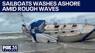 2 sailboats wash up on New Smyrna Beach amid rough wave conditions