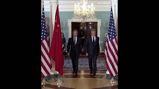 China FM Wang Yi and US Sec. of State Antony Blinken walking into room ahead of talks