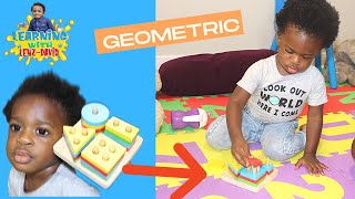 Toddle&#39;s Geometric Stacker |Lenz playing with a grometric stacker