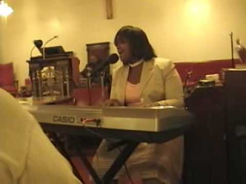 teen Candace Benson leads praise and worship song ...