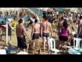 People fighting on the beach