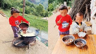 Adorable little girl cook food carry her brother , Rural life